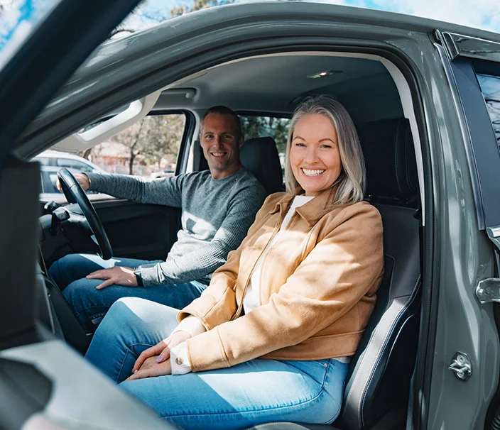 happy lady in community transport vehicle