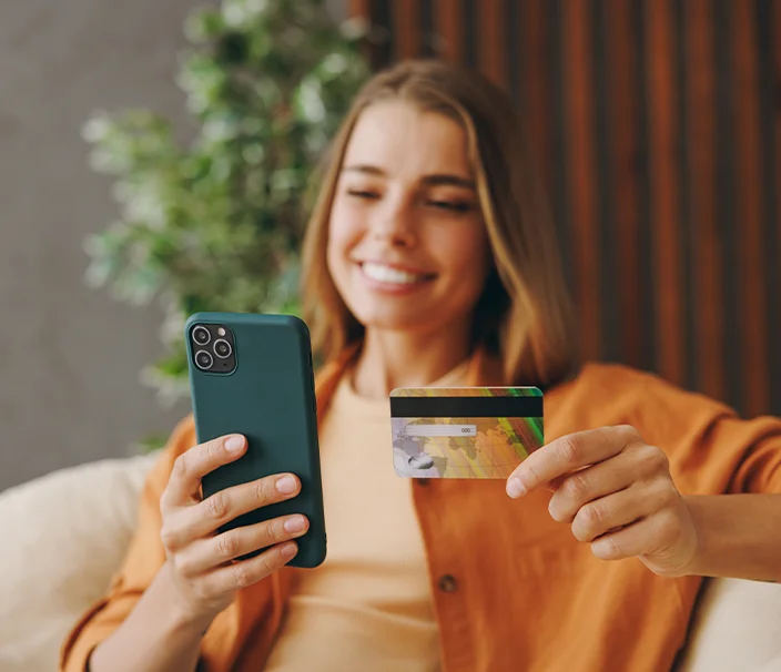 Happy woman making financial donation from phone