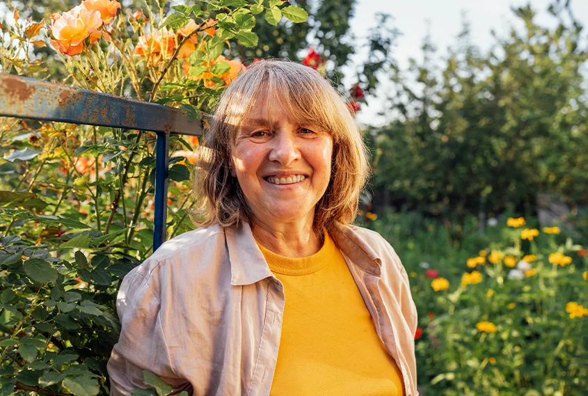 Happy older woman in the garden