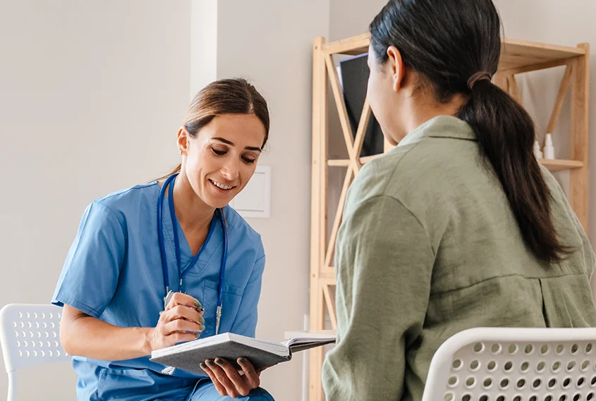 Woman chatting to doctor