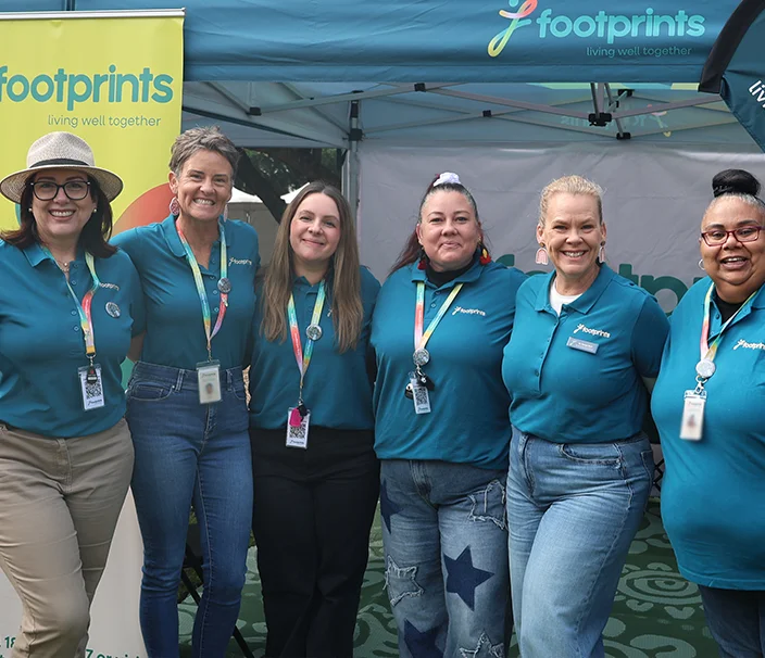 Team of happy Footprints workers